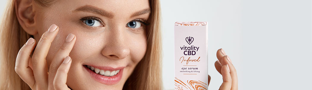 Woman Applying CBD Eye Serum Beneath Eyes