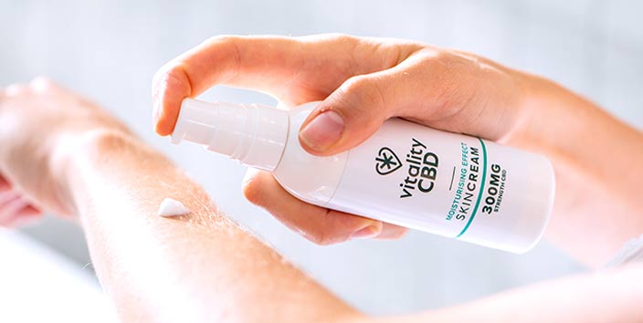 CBD Skin Cream Being Used on Hands and Forearms